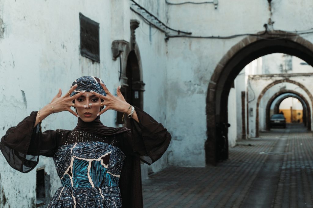 Woman walking alone through a Moroccan medina