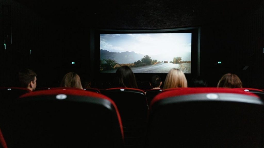 Audience watching a film in a cinema
