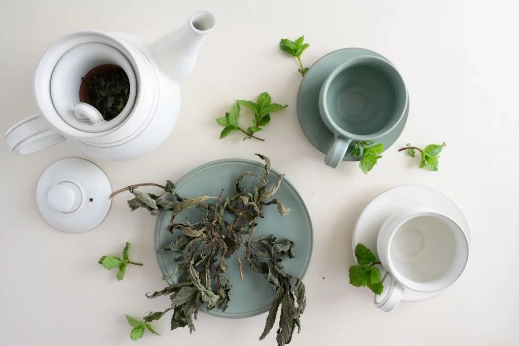 Mint tea being poured from a traditional teapot