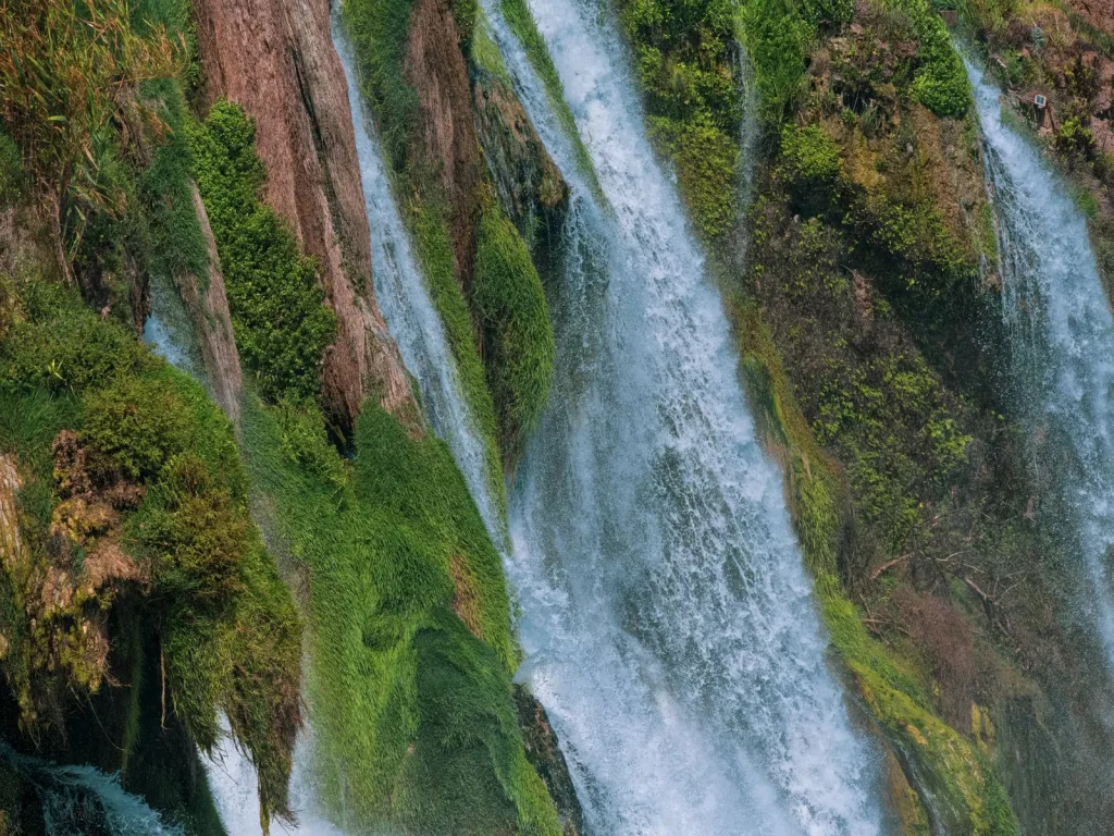 Waterfall cascading over moss-covered rocks