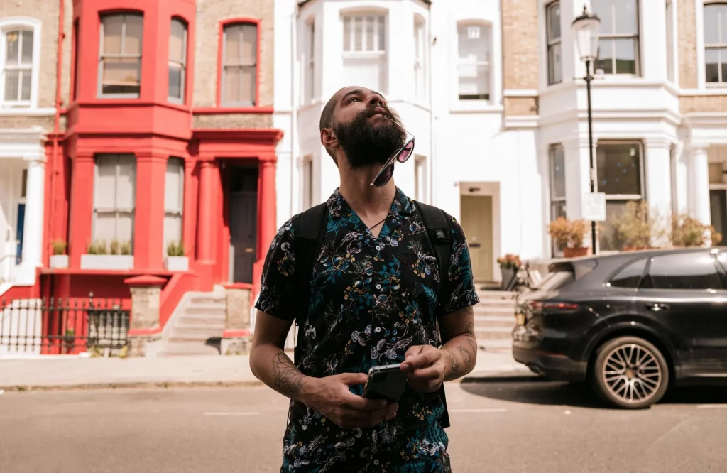 Traveller checking a smartphone on a city street