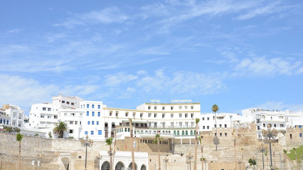 View of the historic Hotel Continental against the blue sky in Tangier, reflecting Moroccan architecture.
