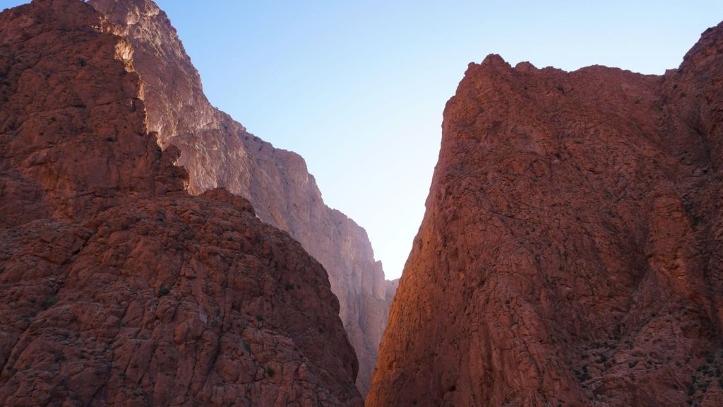Majestic cliffs against a clear sky in Drâa-Tafilalet, Morocco.
