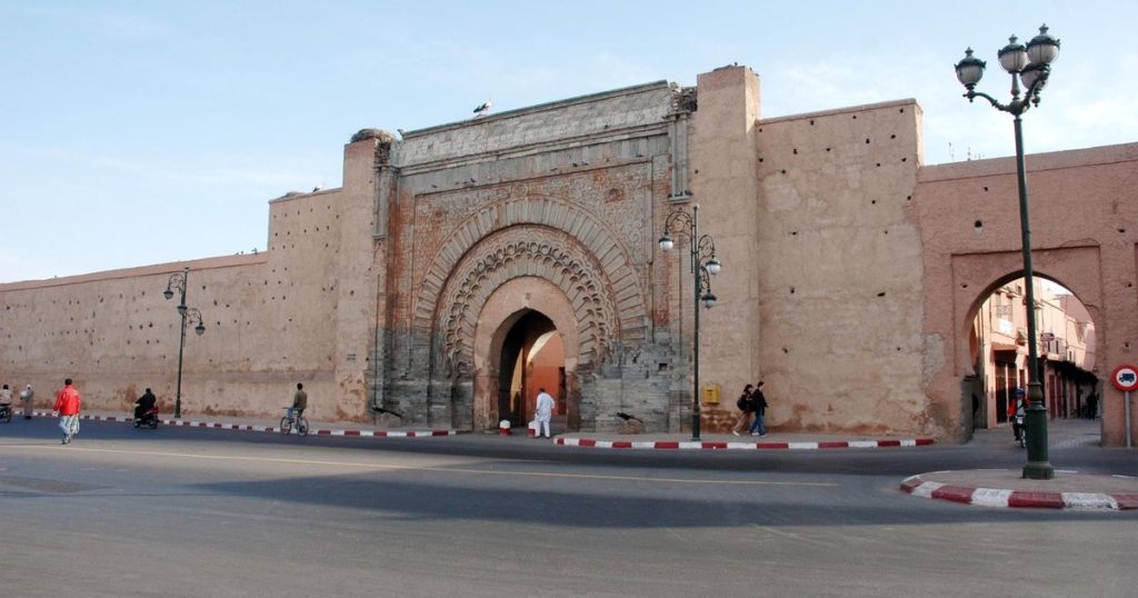 A historic stone gate in the red walls of the Marrakech medina